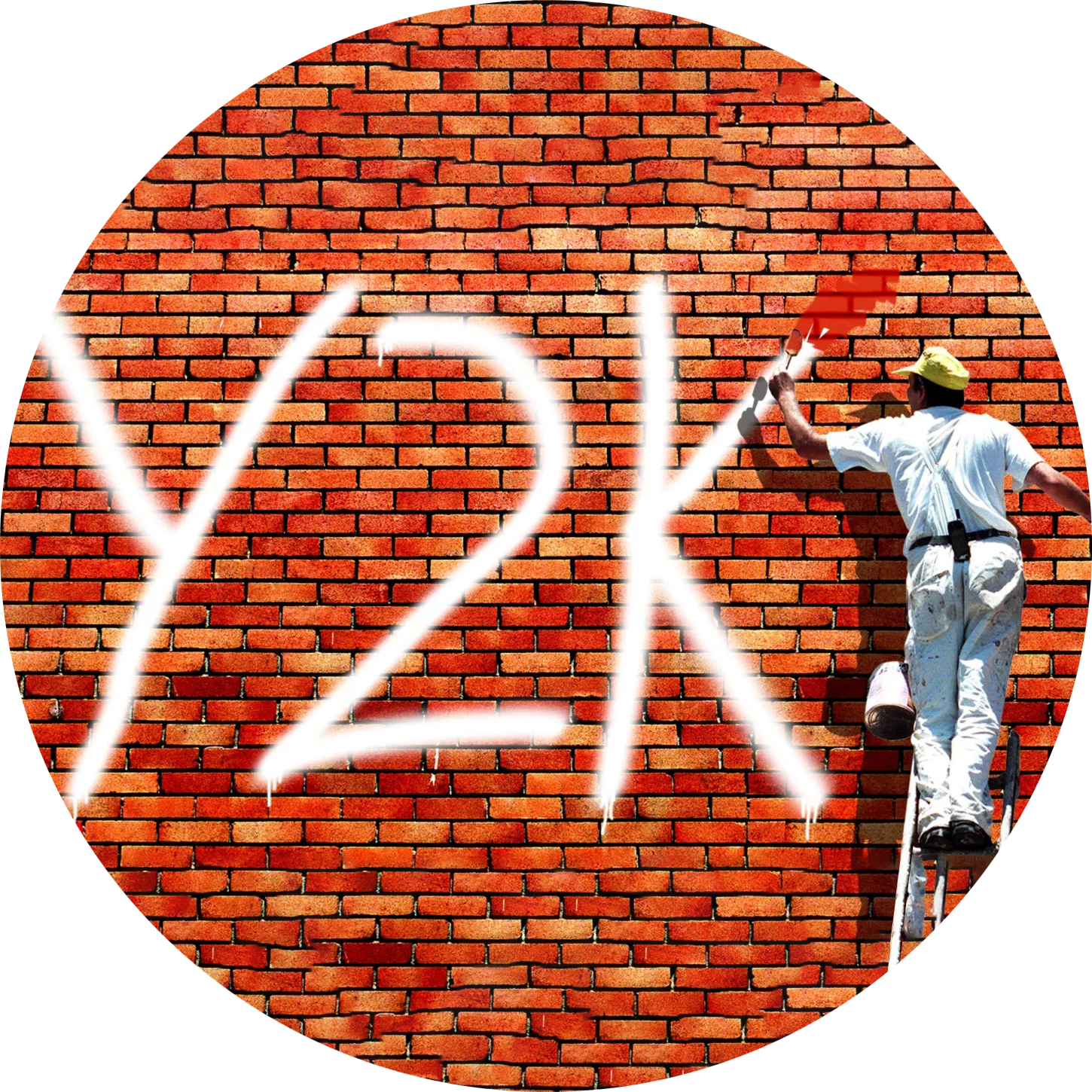 A brickwall with graffiti written Y2K being painted over by a man